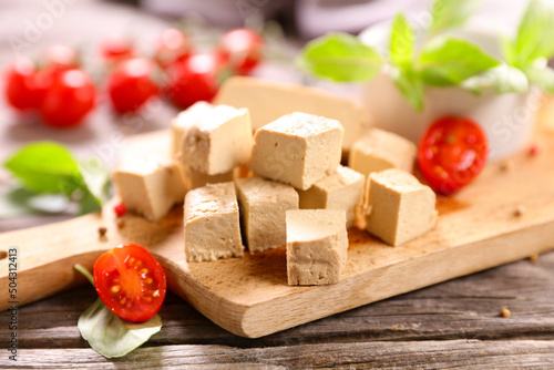 fresh tofu cutting with tomato and basil
