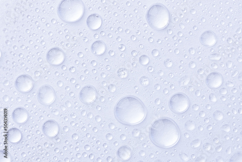 Water drops on white background. Abstract drops of gel. Face serum cosmetics.