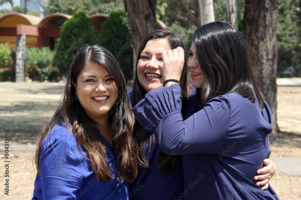Three professional, accomplished, confident, empowered, strong Latin women sisters with straight hair dressed in blue are in a park sharing their happiness and spending time with their family
Three professional, accomplished, confident, empowered, strong Latin women sisters with straight hair dressed in blue are in a park sharing their happiness and spending time with their family