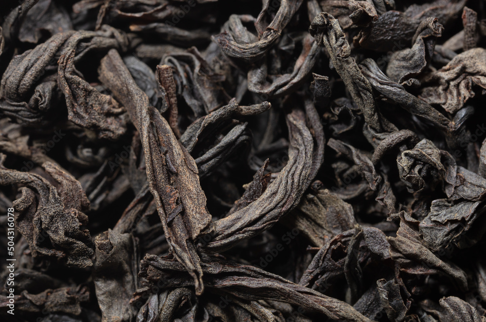 Dried black tea leaves as background. Dried black tea leaves as background.