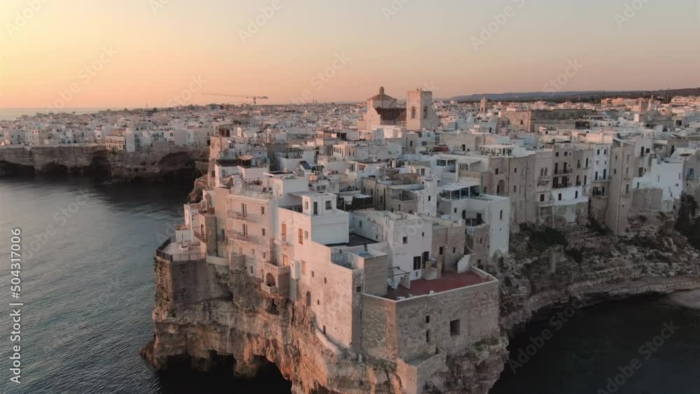 polignano a mare old town aerial shot drone at dawn high view,small rocks village in puglia italy 4k polignano a mare old town aerial shot drone at dawn high view,small rocks village in puglia italy 4k