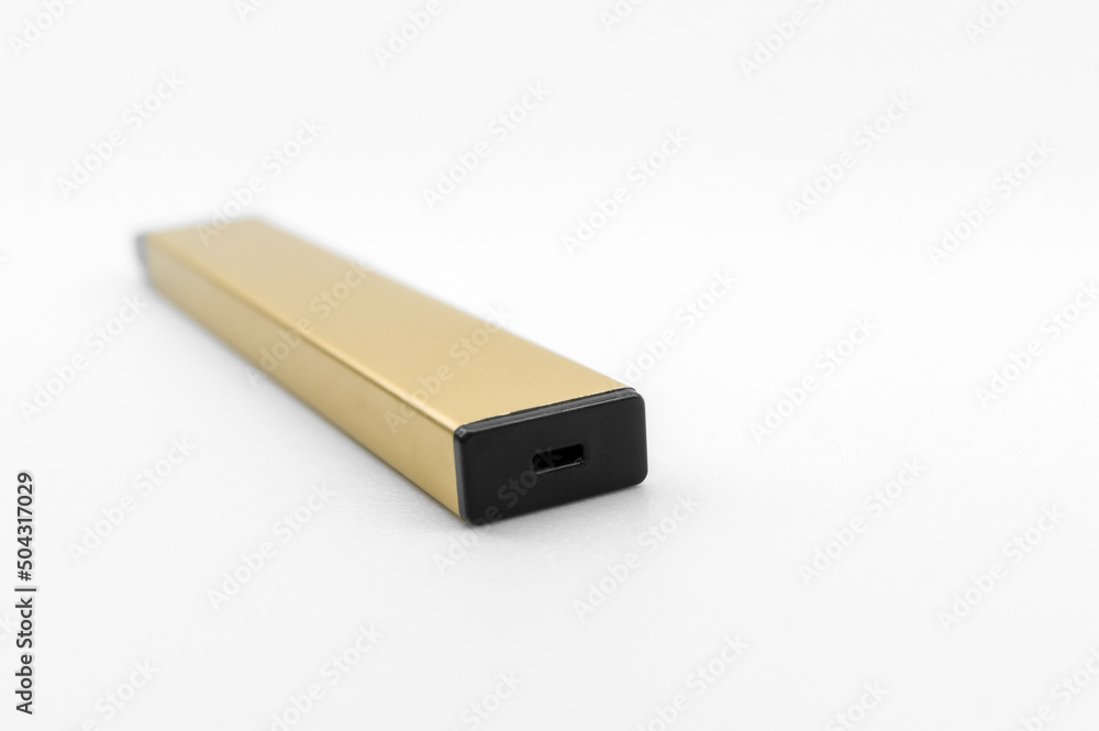 Modern electronic cigarette on a white background. Fashionable smoking device. E-cigarette for vaping. Trendy vape pod. Selective focus Modern electronic cigarette on a white background. Fashionable smoking device. E-cigarette for vaping. Trendy vape pod. Selective focus