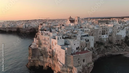 polignano a mare old town aerial shot drone at dawn high view,small rocks village in puglia italy 4k photo