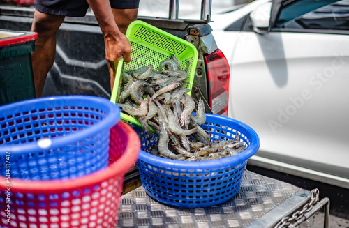 Local fishermen are bringing shrimp for sale at Ban Phe Seafood Market, Rayong, Thailand.