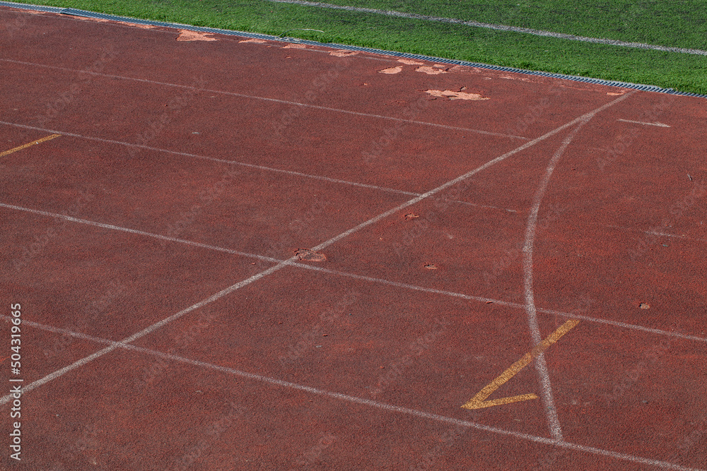 the red surface of the old running track at the stadium the red surface of the old running track at the stadium