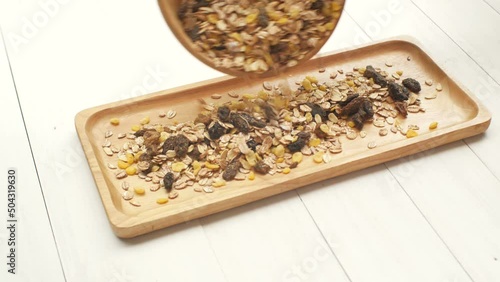 Woman hand placing a natural bowl with organic muesli