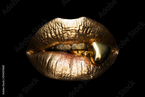 Gold sexy female lips, beautiful lips, beauty golden woman mouth. Jewelry concept.