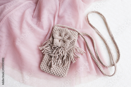 Handmade macrame phone bag. ECO friendly natural macrame cotton bag for woman. Hobby knitting handmade macrame. Modern summer concept for woman.
