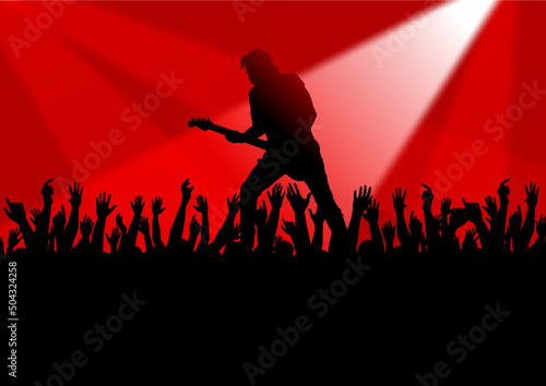 crowd of people play the guitar on the stage