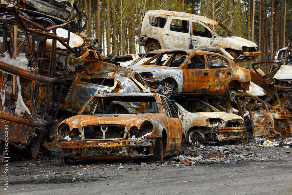 Dump of burnt civilian cars stolen, shoot by the Russian army and destroyed during Russia's war against Ukraine