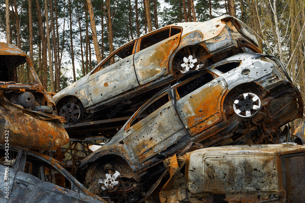 Dump of burnt civilian cars stolen, shoot by the Russian army and destroyed during Russia's war against Ukraine