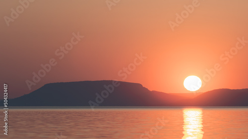 A beautiful and peaceful sunset at the lake © Matthias