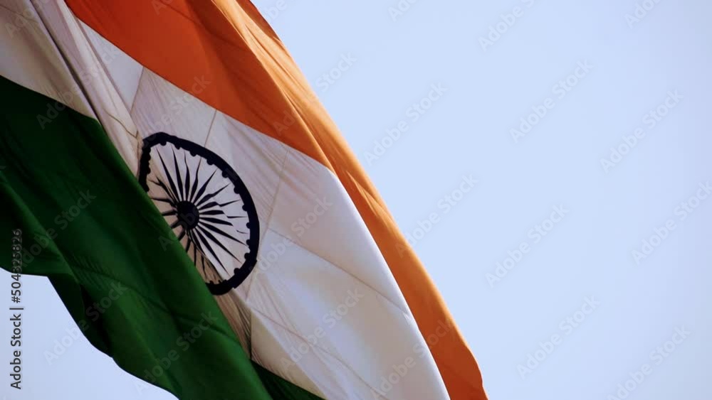 India flag flying high with pride in blue sky, India flag fluttering