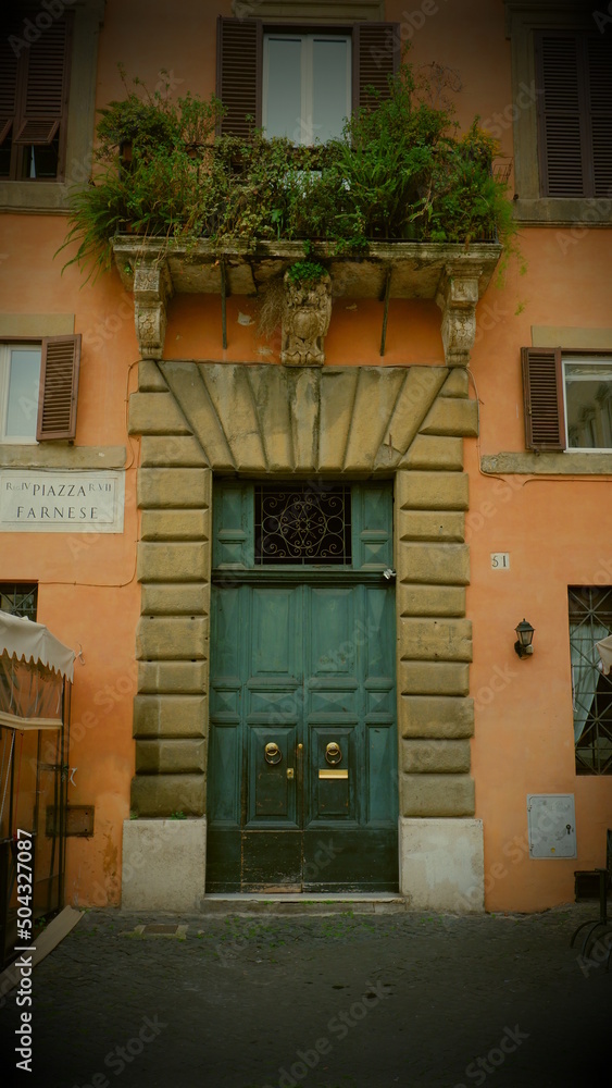 Antique green door in Italy