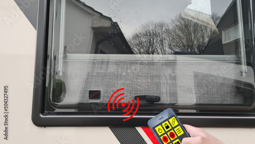 Contact of an alarm system on the window photo