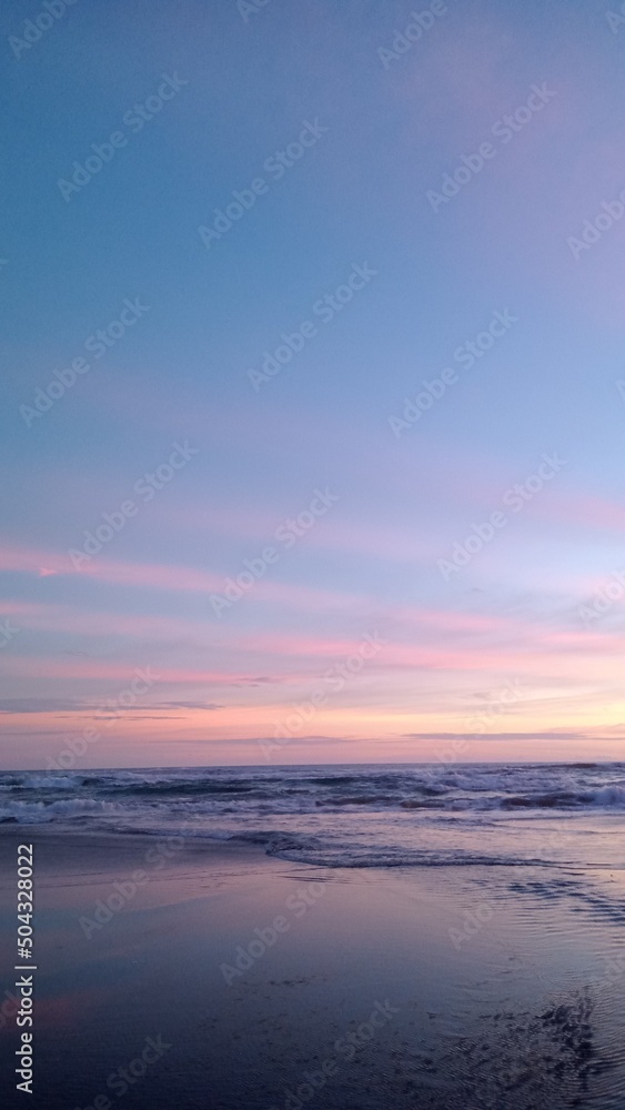 Sea waves water at sunset