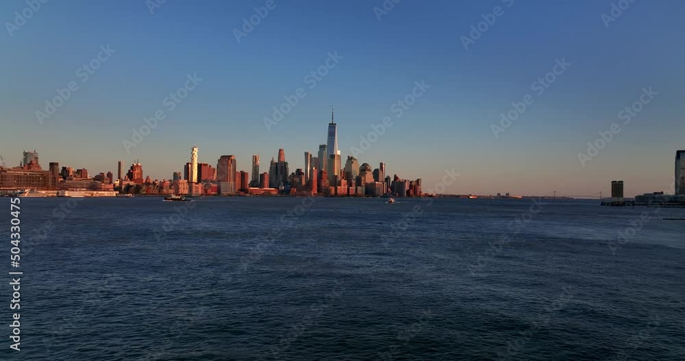 New York City DownTown Aerial traveling from the hudson river on sunset skyline usa New York City DownTown Aerial traveling from the hudson river on sunset skyline usa
