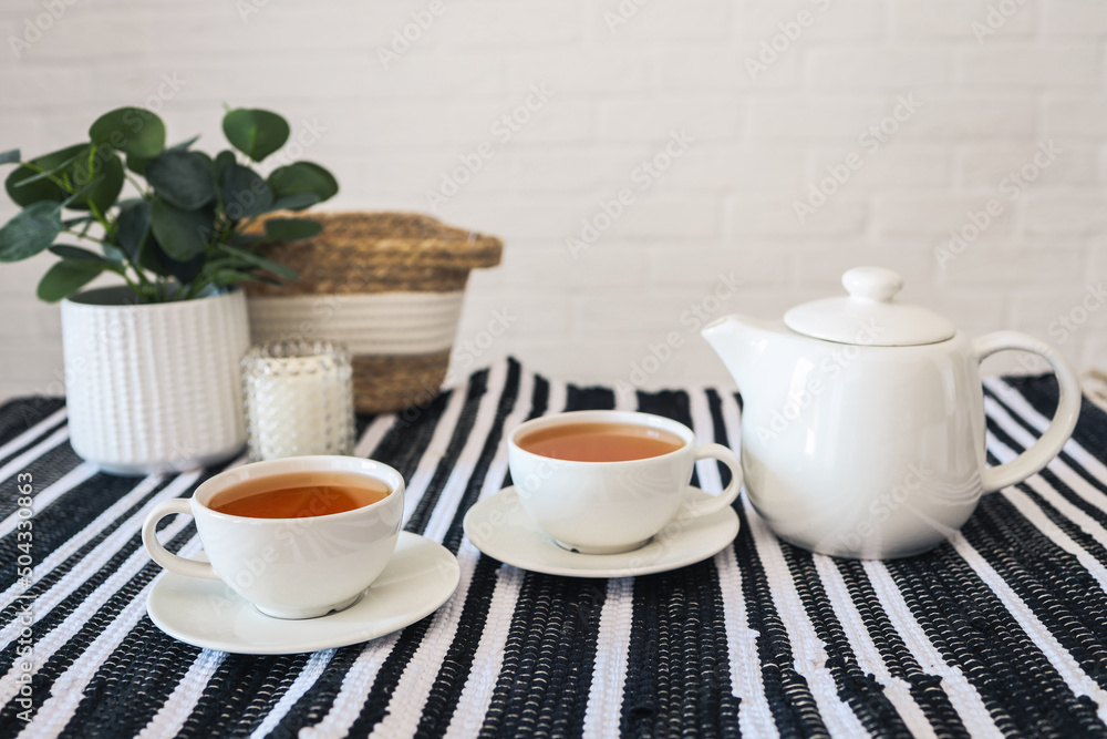 Two cups of tea, tea drinking in Scandinavian cuisine. Beautiful cozy home interior photography Two cups of tea, tea drinking in Scandinavian cuisine. Beautiful cozy home interior photography