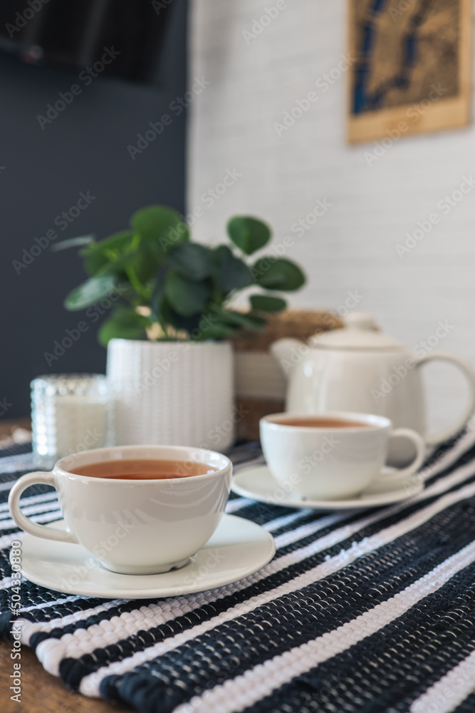 Two cups of tea, tea drinking in Scandinavian cuisine. Beautiful cozy home interior photography Two cups of tea, tea drinking in Scandinavian cuisine. Beautiful cozy home interior photography