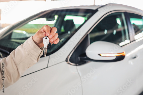 Keys in hand, car in the parking lot