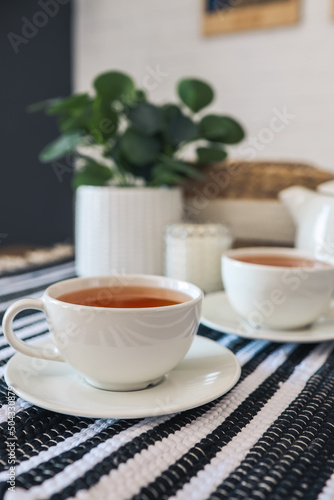 Fototapeta Naklejka Na Ścianę i Meble -  Two cups of tea, tea drinking in Scandinavian cuisine. Beautiful cozy home interior photography
