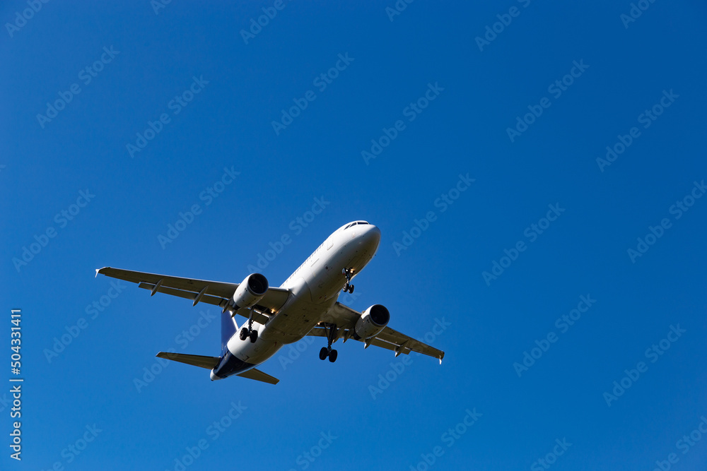 Airplane flying on the blue sky background. Airplane flying on the blue sky background.