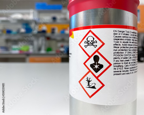 Can with extremely dangerous substance inside, labelled with symbols indicating that the content is toxic, poses health hazard and environmental hazard