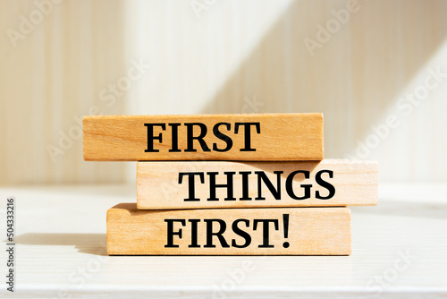 Fényképezés Wooden blocks with words 'First Things First'. Business concept.