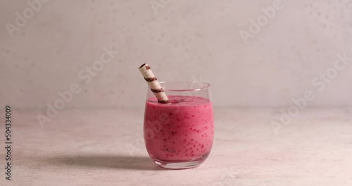 Raspberry smoothie in glass jar. Healthy refreshed homemade beverage.