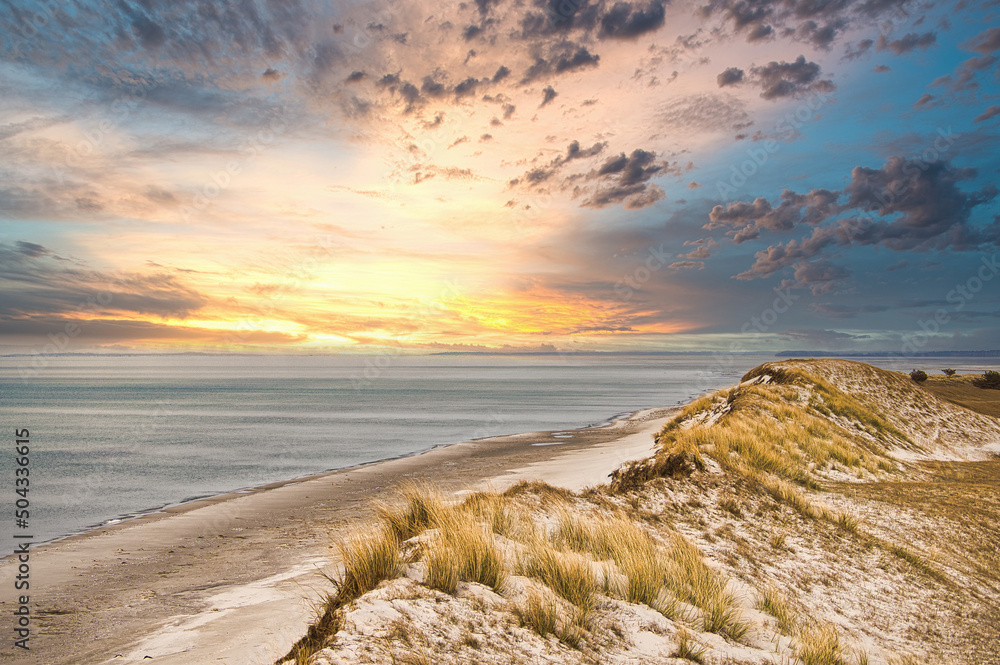 Dramatic sunset at the high dune on the darss. Beach, Baltic Sea, sky and sea.