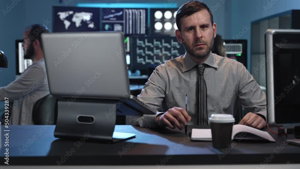Portrait of business trader professional man working in a stock market company office Portrait of business trader professional man working in a stock market company office