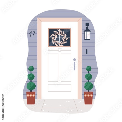 House door exterior. Front home entrance with potted plant, hanging wreath de...