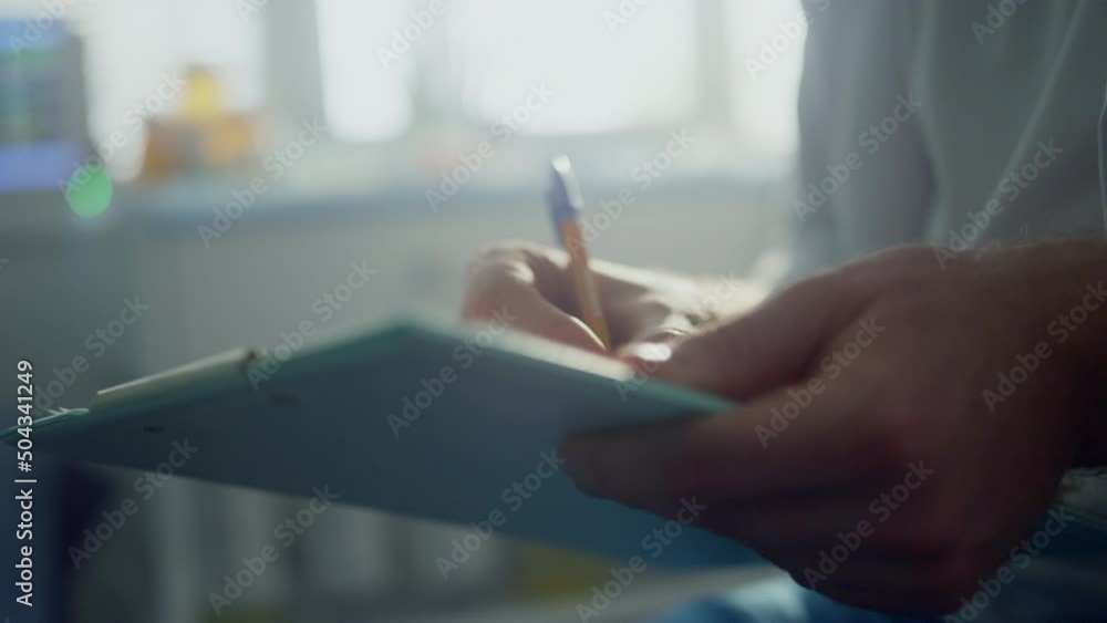Doctor hands filling patient registration form close up. Physician making notes. Doctor hands filling patient registration form close up. Physician making notes.