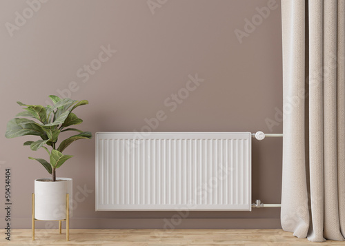 White heating radiator with thermostat on brown wall. Central heating system. Free, copy space for your text. 3D rendering. photo