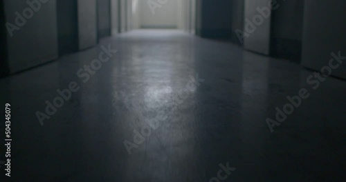The movement of the floor in the dark corridor of the prison. A glare of light in the menacing floor, the surface. There is light at the end of the corridor. Low mental state.