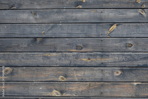 Old grey wooden background. Rustic planks with knots as a background texture