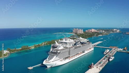 Aerial panning shot of the port of Nassau and Paradise Island with cruise ships in New Providence, The Bahamas. 4K photo