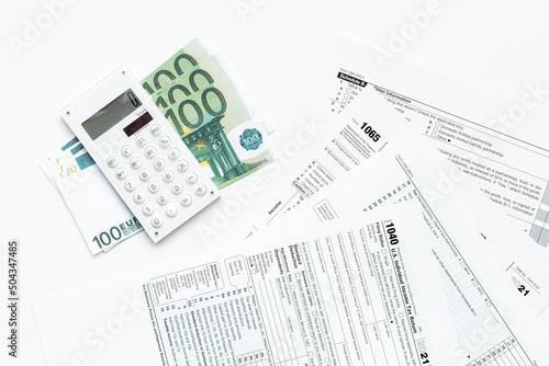 Annual tax form under US law with money cash. Tax payment season