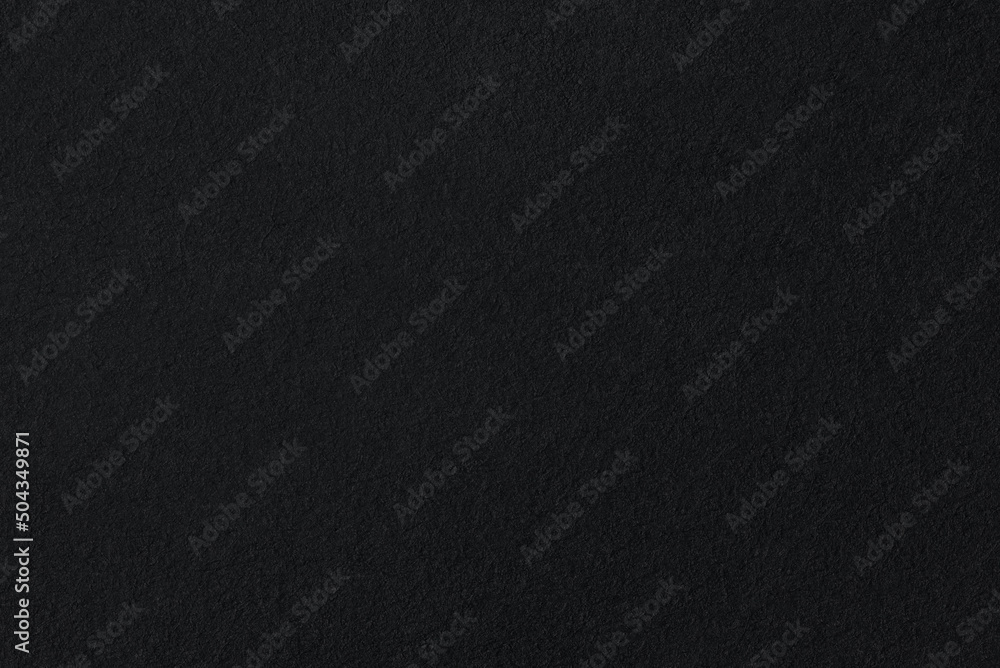 black coarse paper macro background