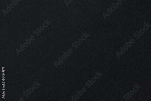 black coarse paper macro background