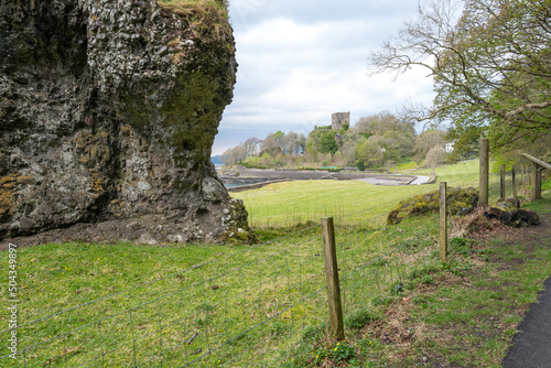 Photo View of Dog Stone with Dunollie Castle in the background near Oban, Argyll