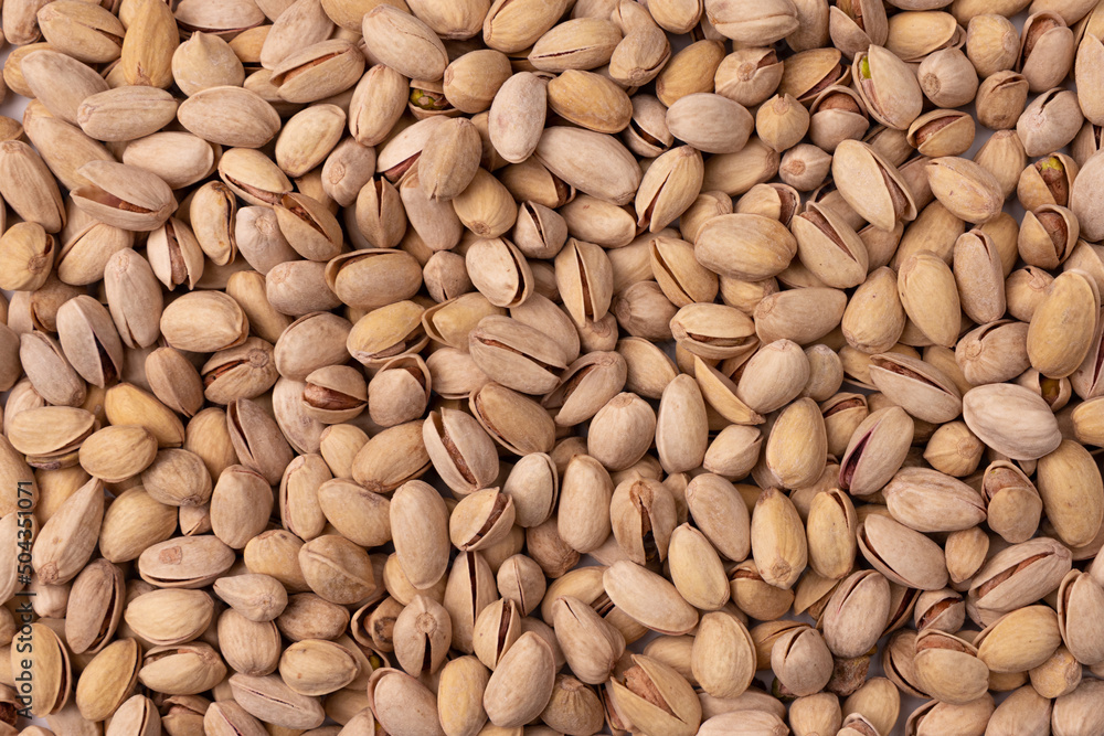 background of unpeeled almond nuts, close up background of unpeeled almond nuts, close up