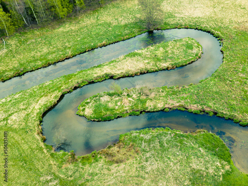 Meandering and twisting river. View from above. Ploucnice river Czech Republic photo