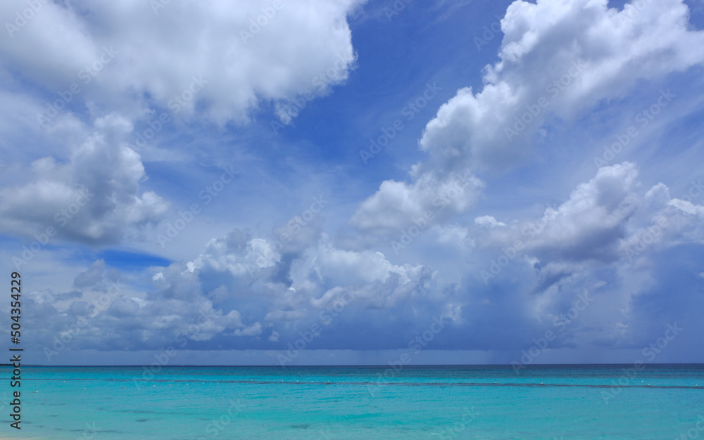 Travel background with clouds sky and Caribbean sea.