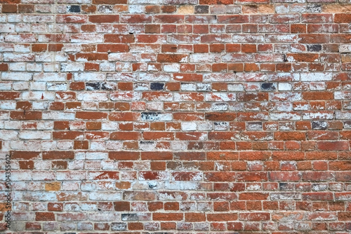 Old brick cracked wall background texture.