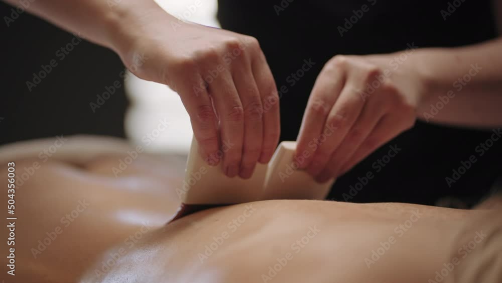 traditional egyptian brush massage for relaxation and meditation, woman is relaxing in spa-salon traditional egyptian brush massage for relaxation and meditation, woman is relaxing in spa-salon