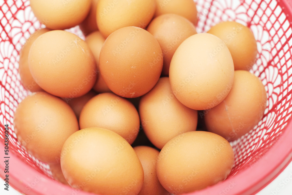 Eggs in a basket - Eggs isolated on a white background Eggs in a basket - Eggs isolated on a white background