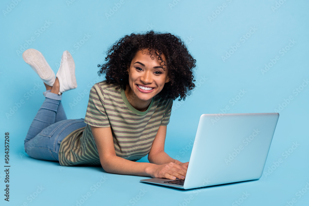 Photo of lady manager use netbook chat workshop seminar wear striped trendy t-shirt isolated blue color background Photo of lady manager use netbook chat workshop seminar wear striped trendy t-shirt isolated blue color background