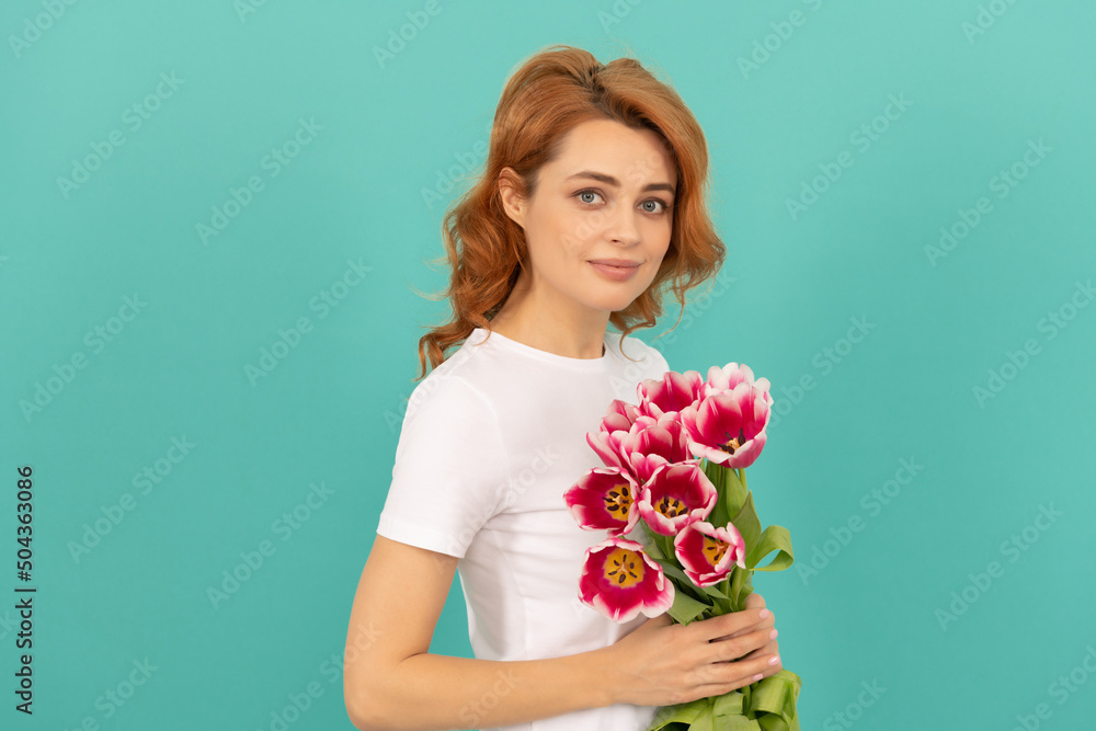 positive girl with tulip flower bouquet on blue background positive girl with tulip flower bouquet on blue background