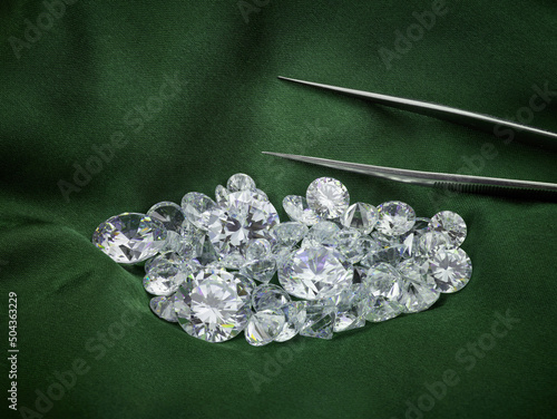 Loose Diamond Parcel on Green Silk Background. Luxury Diamond Photograph. Ethical Eco-Friendly Green Diamonds. 